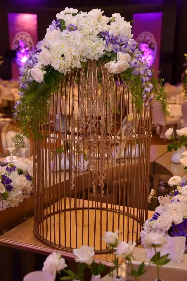 Gilded birdcage with flowers