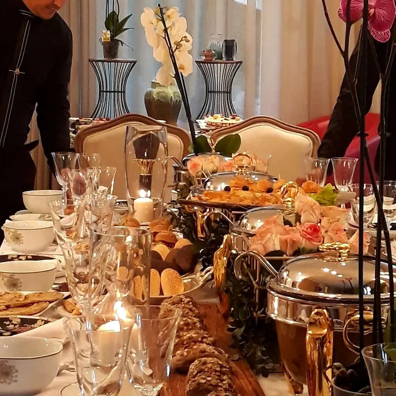 Brunch on a long table, pink orchids