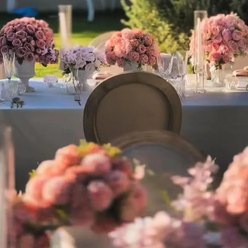 Powder-pink roses and silver chargers